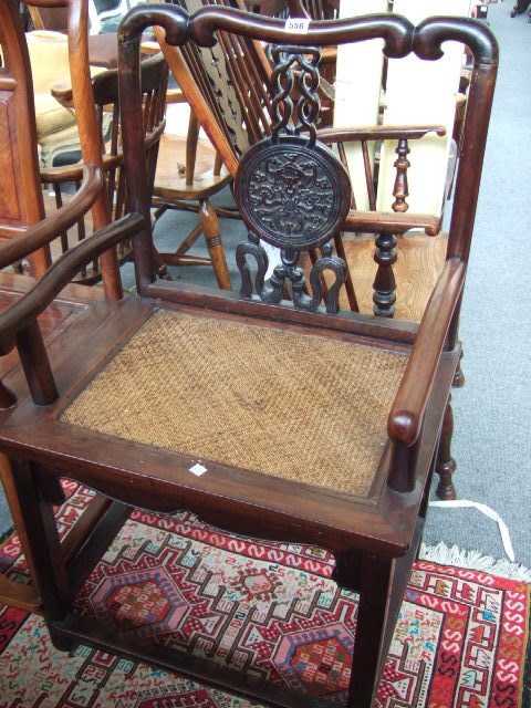 Appraisal: A late th century early th century hardwood open armchair