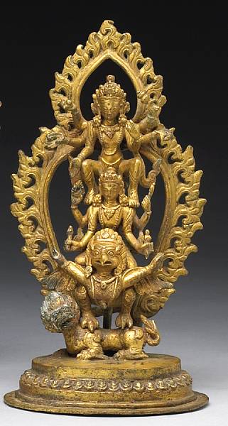 Appraisal: A Nepalese gilt bronze figural group Century Featuring the Harihariharivahanobdhava