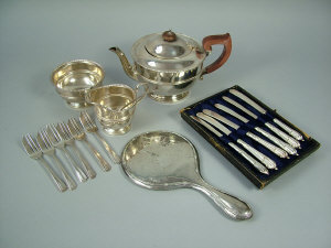 Appraisal: A three piece silver tea set Birmingham comprising of a