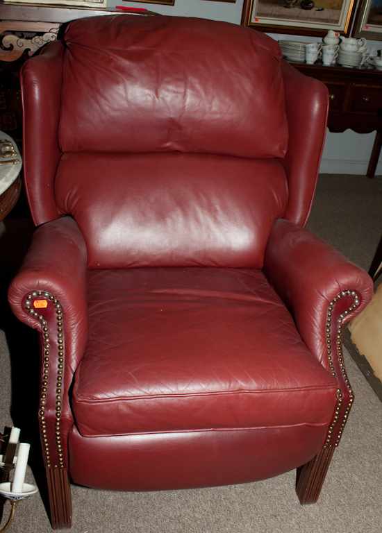 Appraisal: Chippendale style vinyl upholstered wing chair Estimate - All items