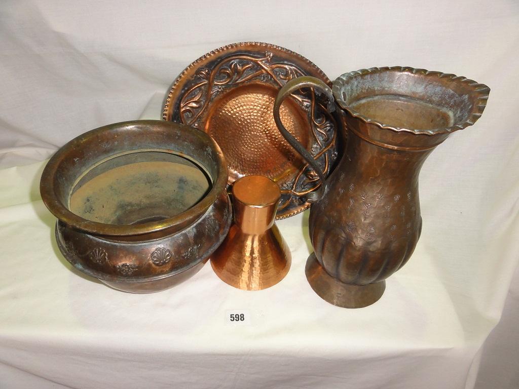 Appraisal: A copper bowl jardiniere a beaten copper plate a flared