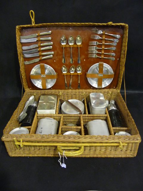 Appraisal: A Swedish wicker picnic basket fitted interior containing aluminium cutlery