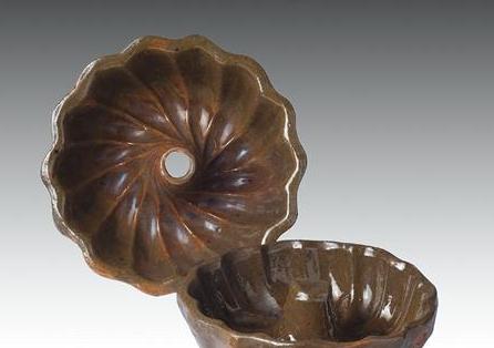 Appraisal: FOUR NEW ENGLAND OR NEW YORK GLAZED REDWARE CAKE MOLDS