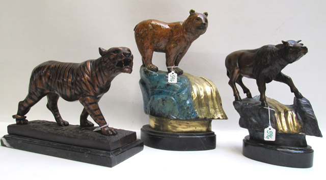 Appraisal: THREE BRONZE ANIMAL SCULPTURES consisting of a bear tiger and