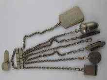 Appraisal: A silver plated chatelaine with six items viz a thimble