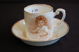 Appraisal: OUR EMPIRES LITTLE PRINCESS CUP SAUCER