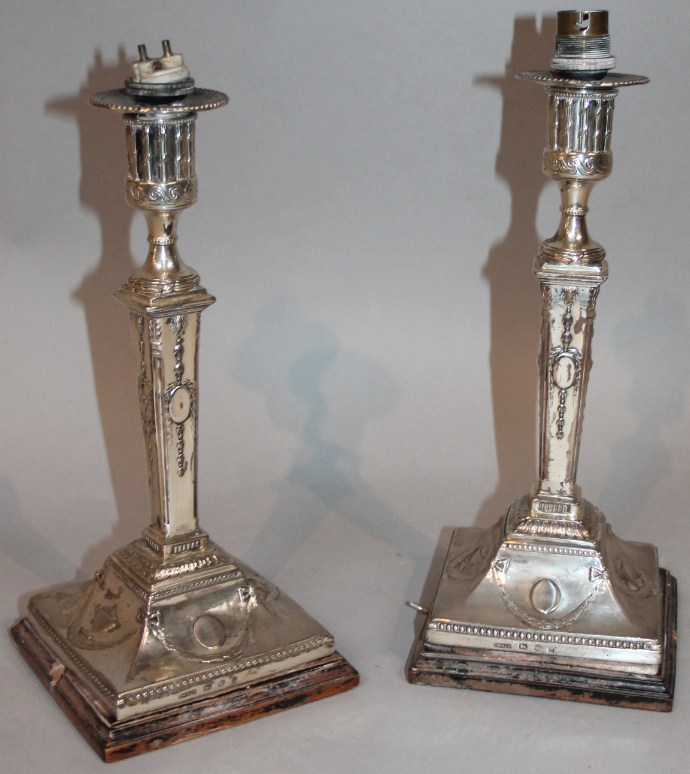 Appraisal: A pair of George III silver candlesticks by John Winter