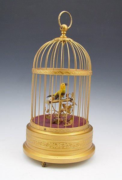 Appraisal: SINGING BIRD AUTOMATON The feathered bird moves his head beak