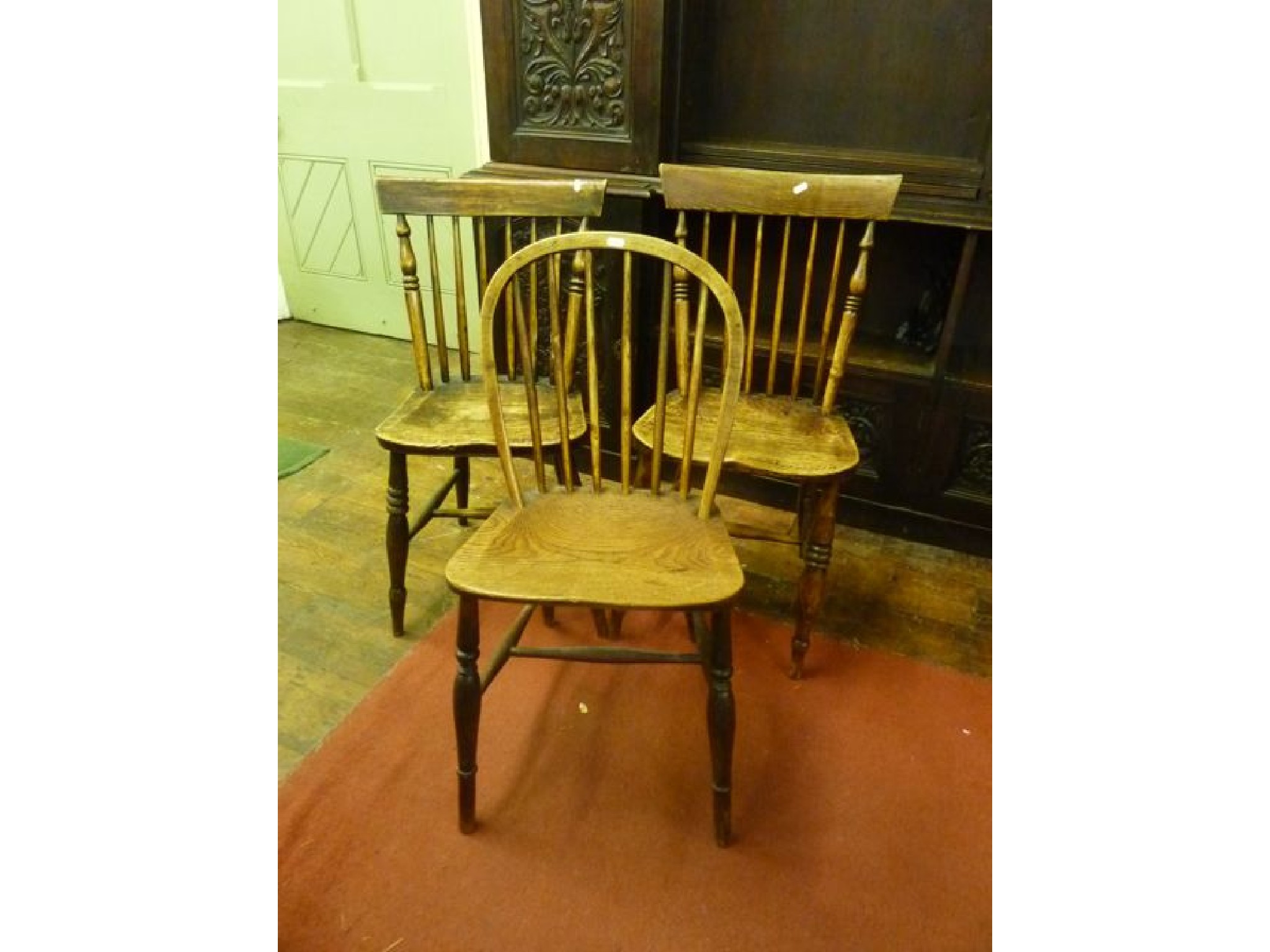 Appraisal: Three various th century stick back kitchen chairs in mixed