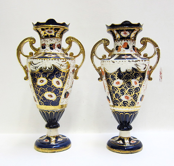 Appraisal: PAIR ENGLISH PORCELAIN URNS Imari pattern with blue orange and