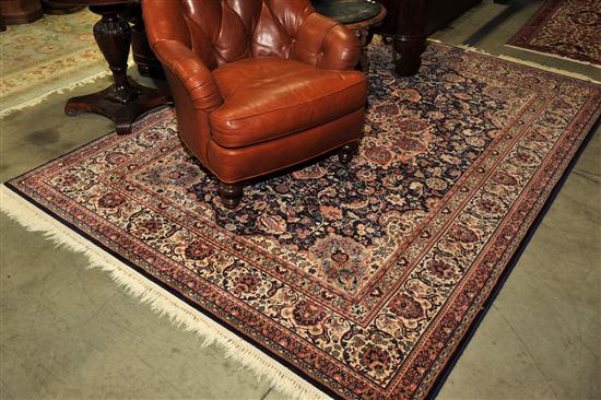 Appraisal: ORIENTAL STYLE RUG Navy blue field having multiple borders and