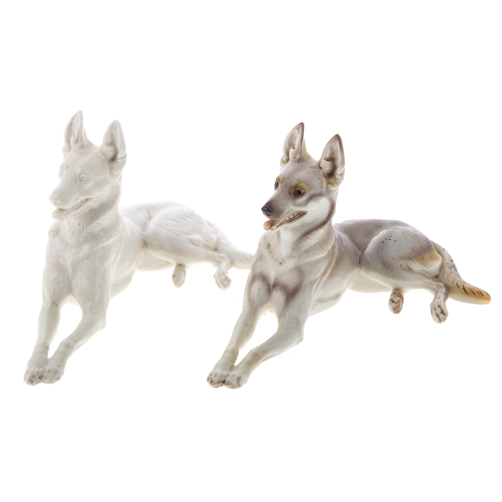 Appraisal: TWO NYMPHENBURG PORCELAIN GERMAN SHEPHERDS Circa s recumbent German Shepherd