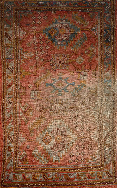 Appraisal: A TURKEY OUSHAK RUG with an all over stylistic design