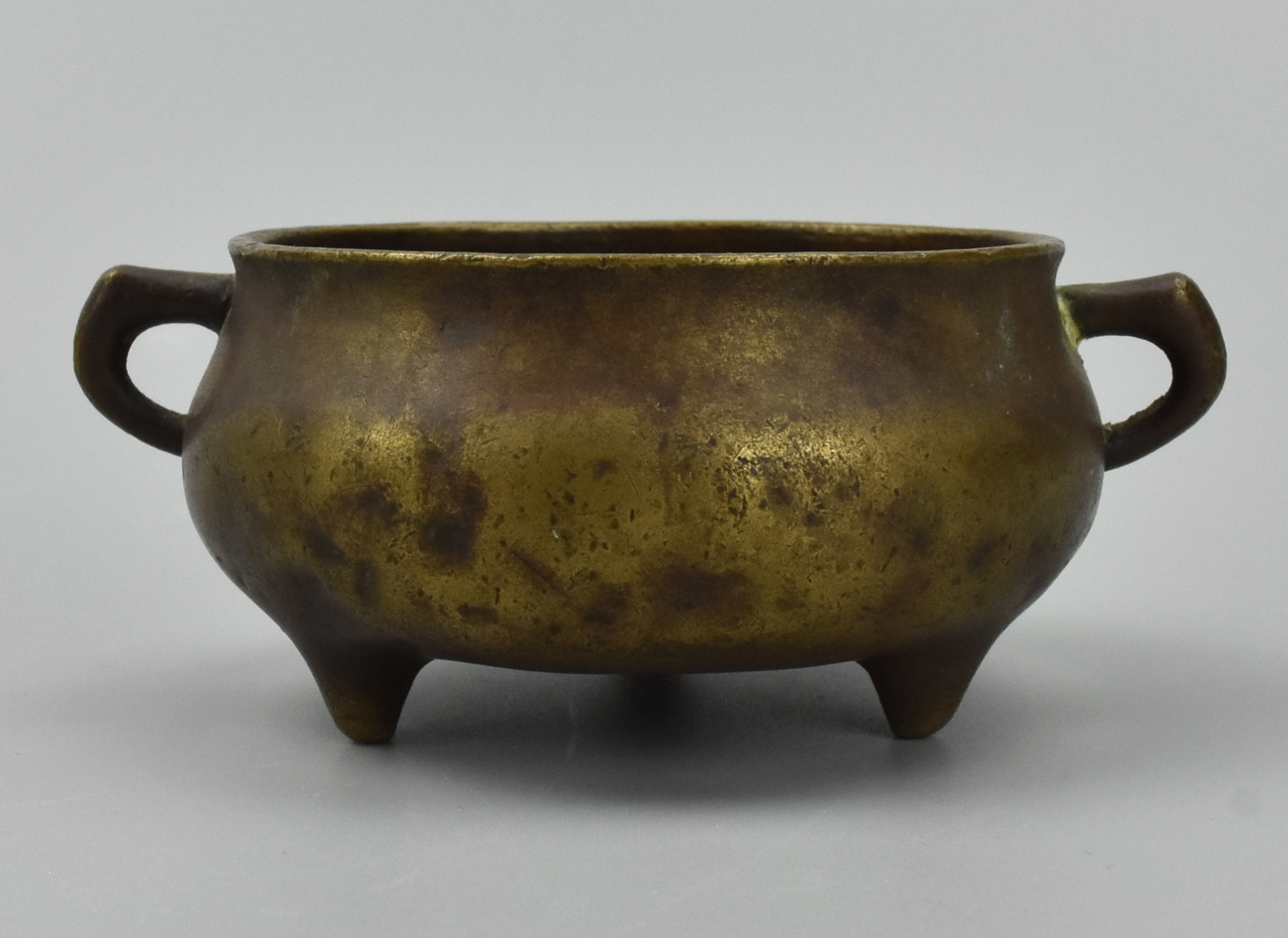 Appraisal: SMALL CHINESE BRONZE CENSER W LOOP HANDLES QING D A