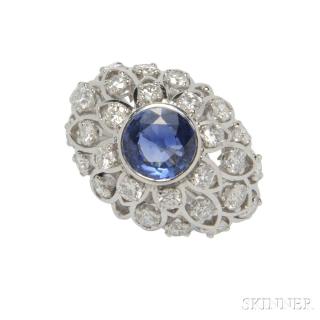 Appraisal: Platinum Sapphire and Diamond Ring centering a bezel-set circular-cut sapphire