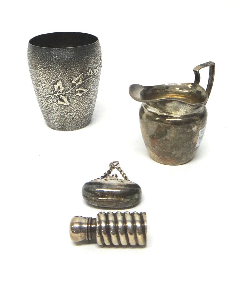 Appraisal: A Victorian silver beaker decorated with a bird's head an