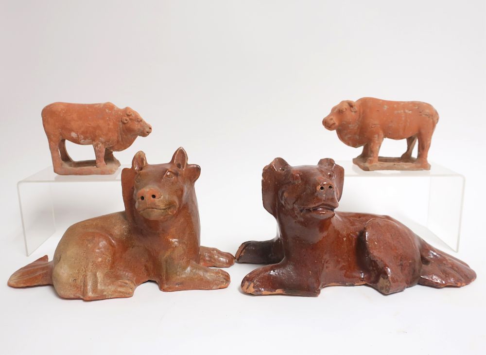 Appraisal: Pair of Han Style Terracotta Bulls and Dogs Small formed