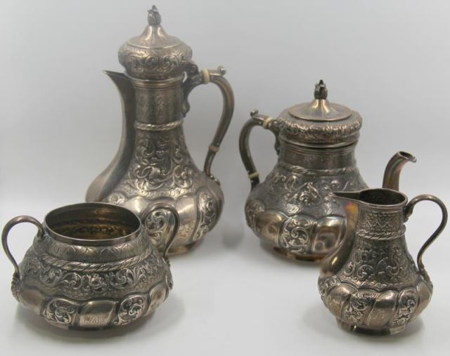 Appraisal: STERLING Piece Repousse Silver Tea Service Includes a coffee pot