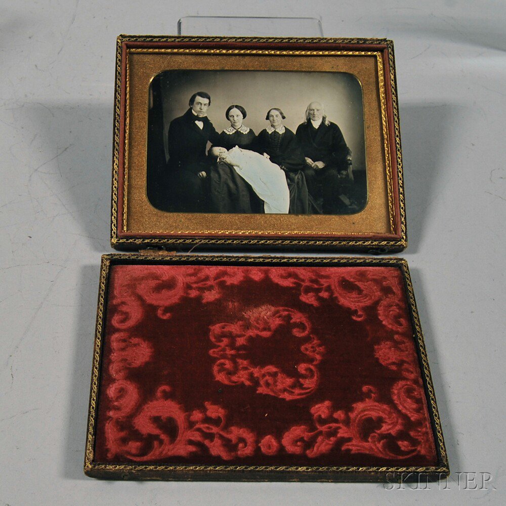 Appraisal: Half-plate Daguerreotype Three-generation Family Portrait depicting an elderly couple a