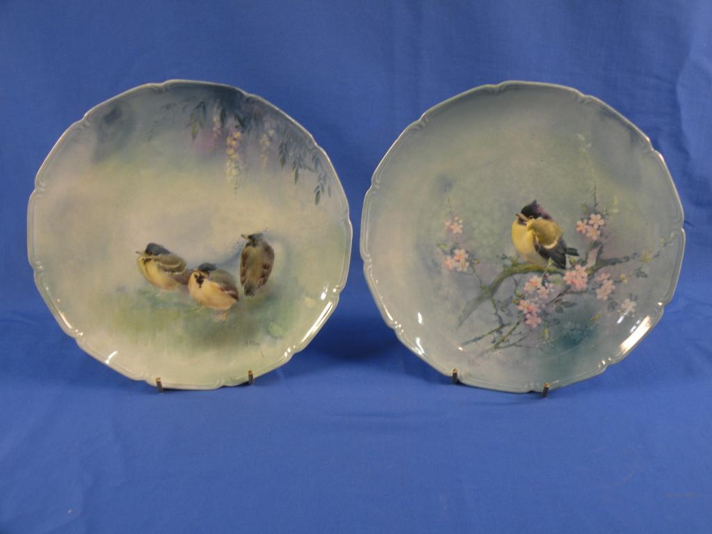 Appraisal: A pair of Royal Doulton Titanium plates each decorated with