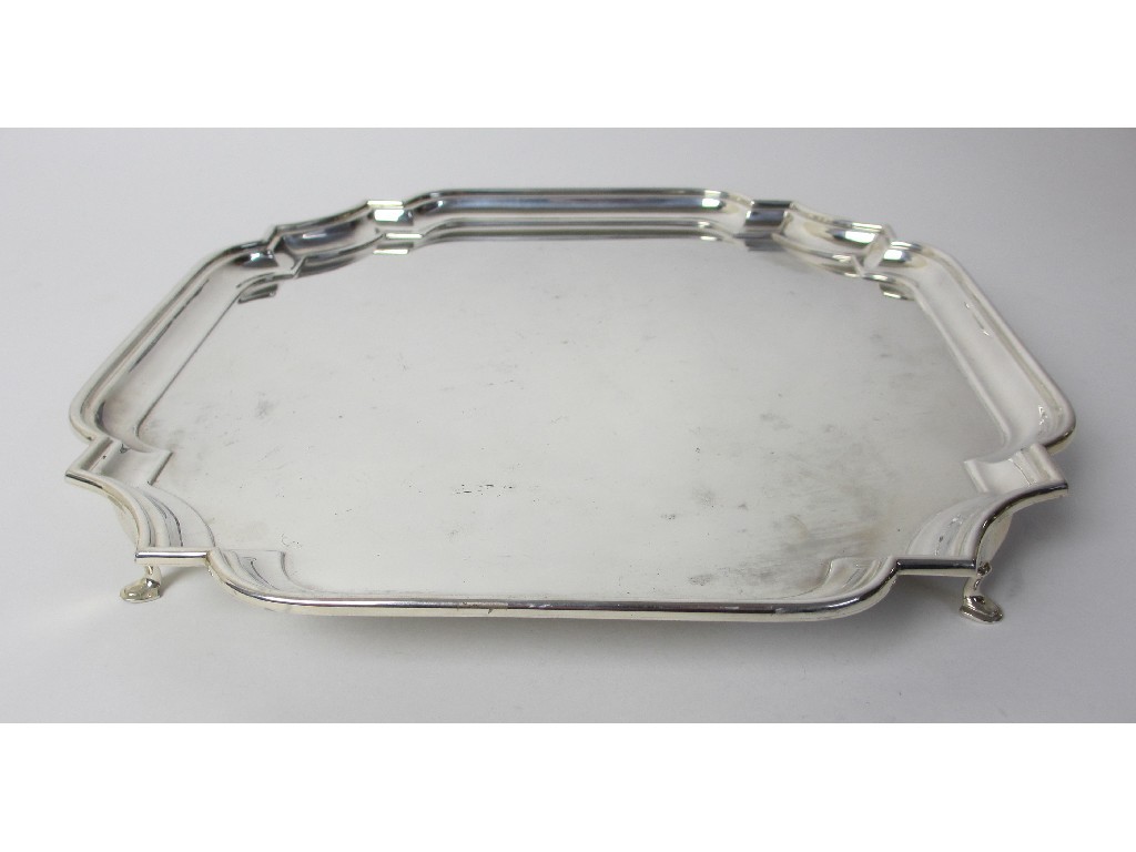 Appraisal: A silver salver of square form with scalloped corners and