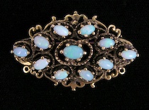 Appraisal: A Ladies' Brooch Set With Opals A ladies' yellow gold