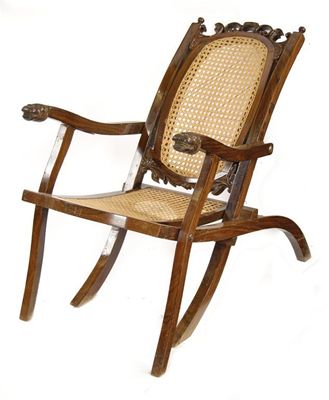 Appraisal: An Anglo-Indian rosewood planter's chair with caned seat and back