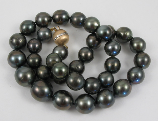 Appraisal: BLACK PEARL AND FOURTEEN KARAT GOLD NECKLACE with graduated dark