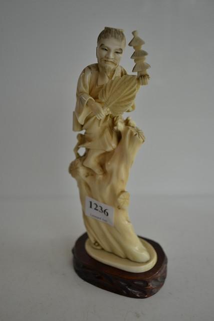 Appraisal: JAPANESE CARVED FIGURE WITH PADOGA AND FAN