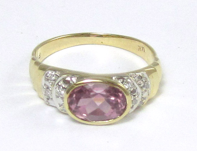 Appraisal: PINK TOURMALINE DIAMOND AND FOURTEEN KARAT GOLD RING centering a