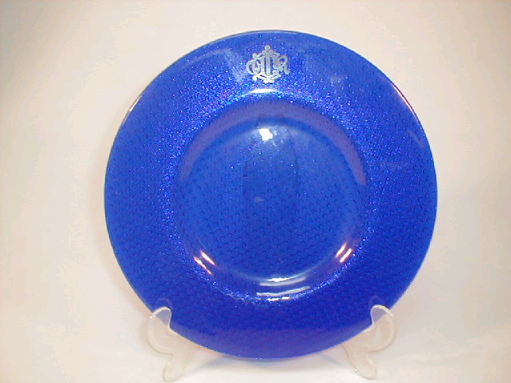 Appraisal: A Christian Dior blue glass platter the rim decorated with