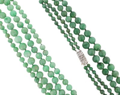 Appraisal: A two row graduated jade bead necklace The beads graduated