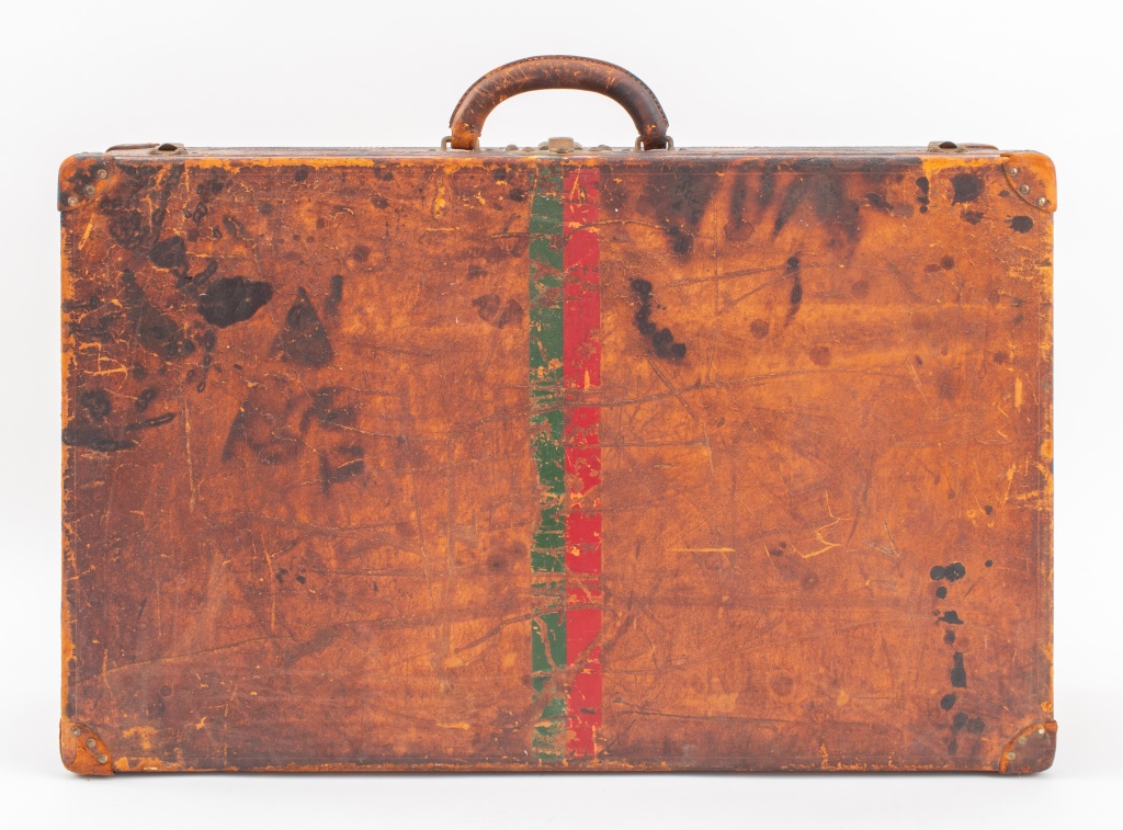 Appraisal: LOUIS VUITTON COVERED LEATHER SUITCASE Vintage Louis Vuitton covered leather