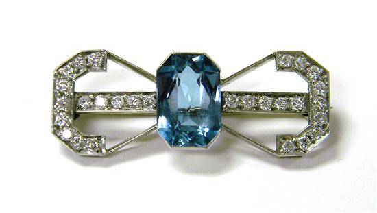 Appraisal: JEWELRY Blue Topaz and diamond brooch platinum bow design with