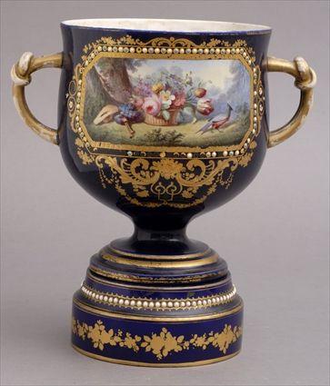 Appraisal: ASSEMBLED SEVRES PORCELAIN TWO-HANDLED URN AND STAND Each with underglaze