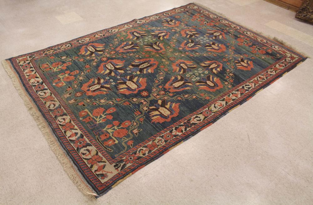 Appraisal: HAND KNOTTED TURKISH CARPET stylized floral design on blue green