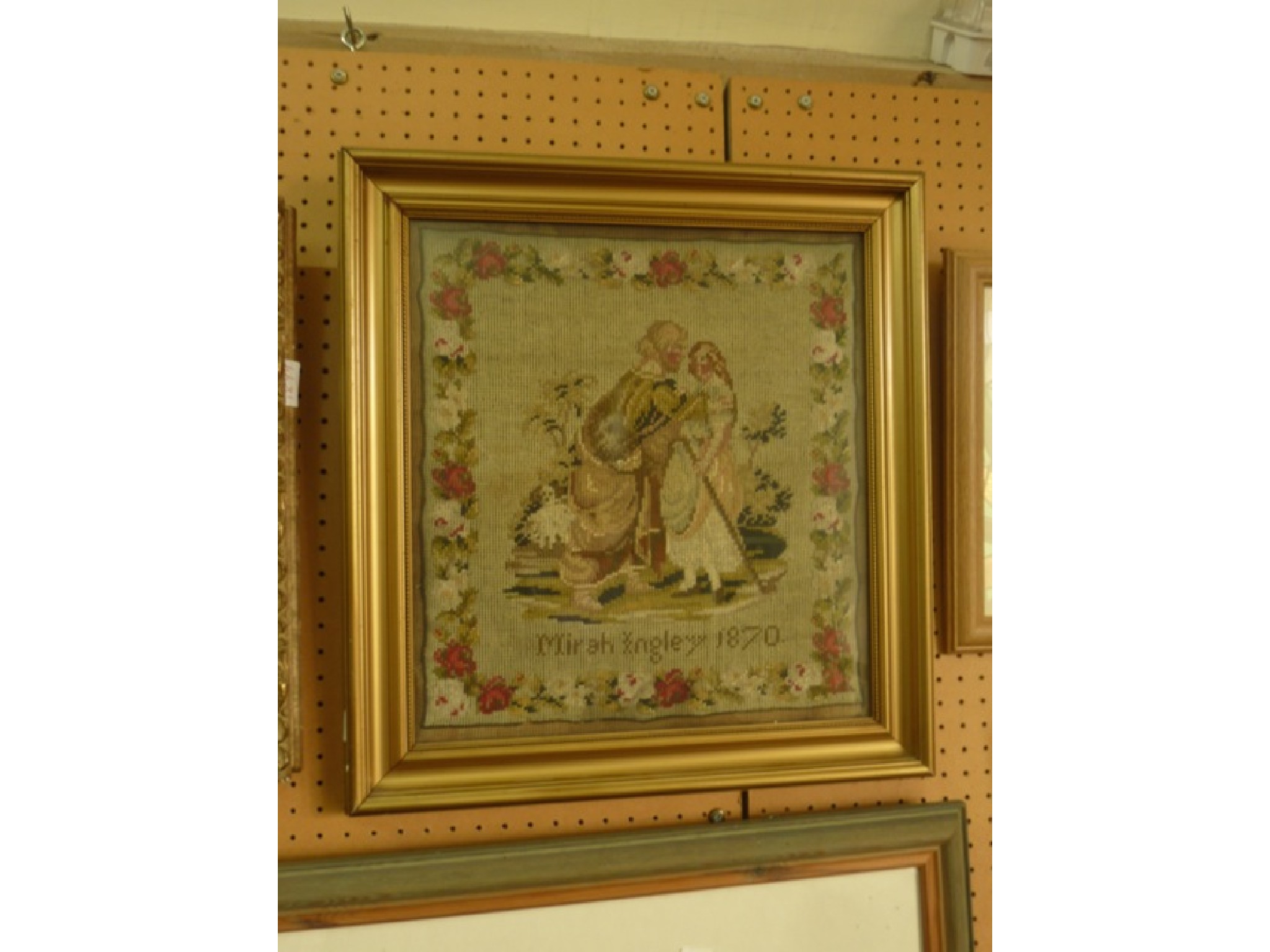 Appraisal: A th century needlework panel showing a mother and child