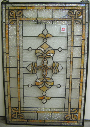 Appraisal: A STAINED AND LEADED IRIDESCENT GLASS WINDOW PANEL centered with