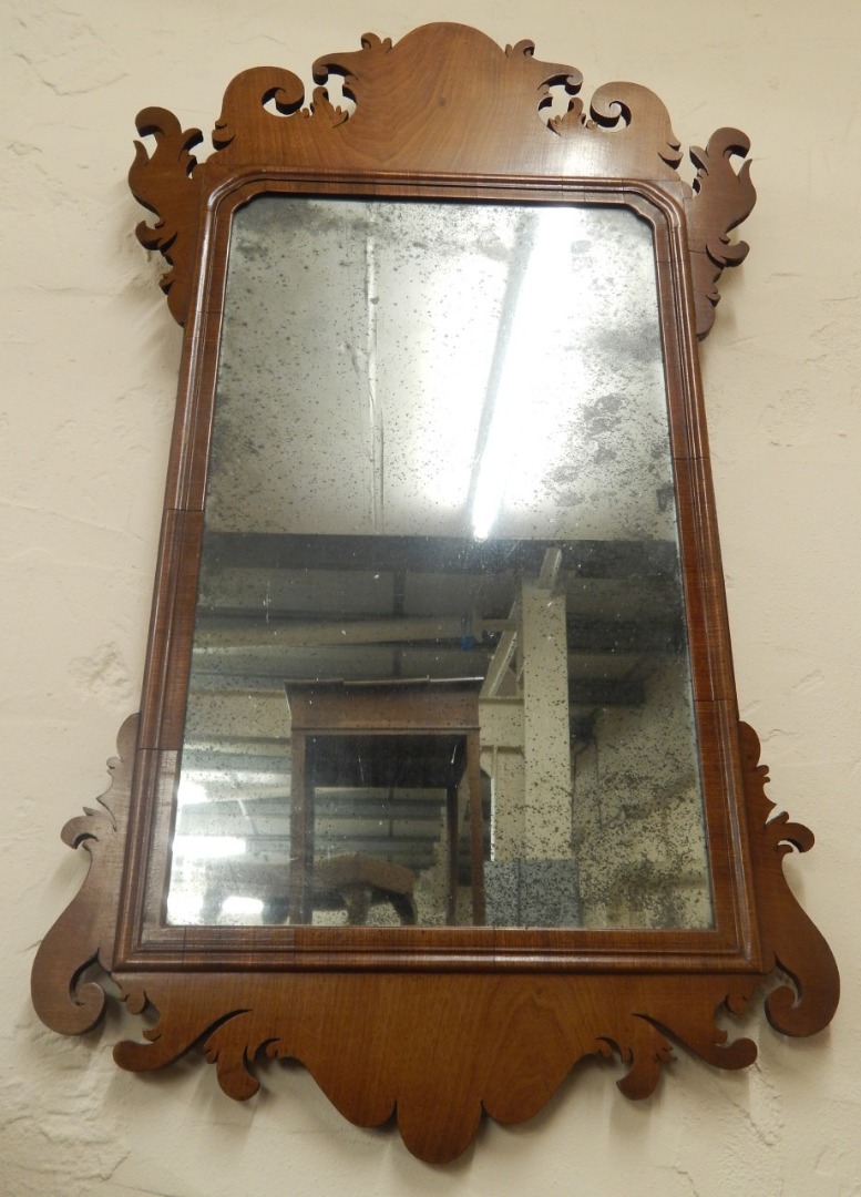 Appraisal: An thC mahogany fret framed wall mirror the rectangular plate