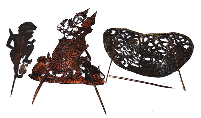 Appraisal: THREE INDIAN SILHOUETTE SHADOW PUPPETS probably made of stiffened card