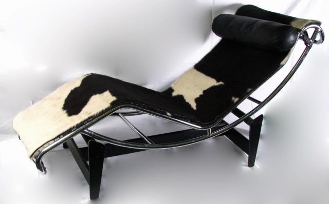 Appraisal: Le Corbusier chaise lounge black and white pony chrome frame