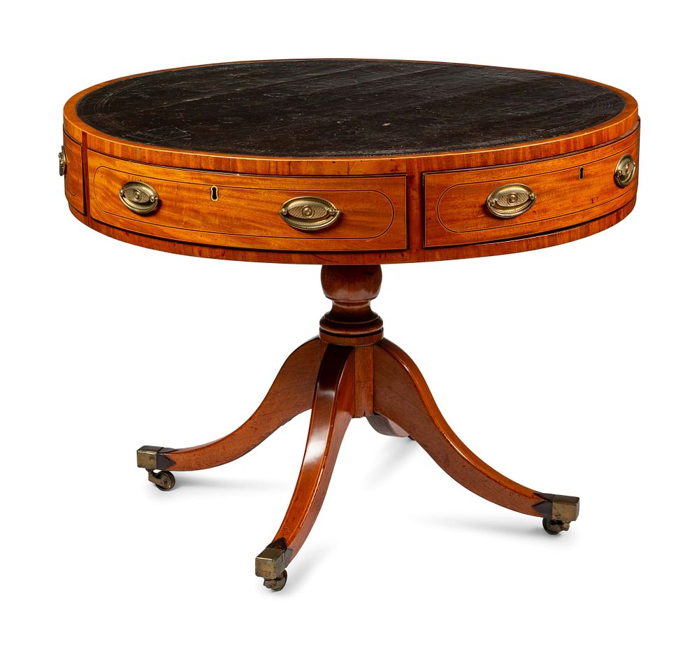 Appraisal: A Regency Mahogany and Satinwood Drum Table A Regency Mahogany