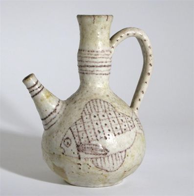 Appraisal: A Gambone earthenware ewer painted with stylised fish in aubergine