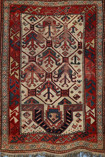 Appraisal: A KASAK PRAYER RUG with a hooked motif and polychrome