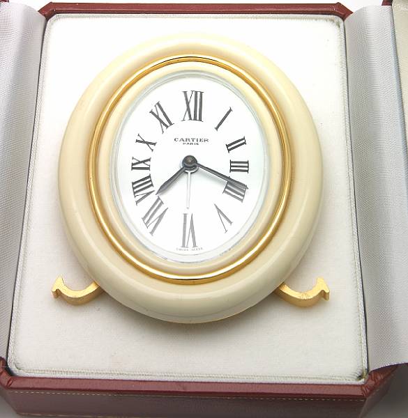 Appraisal: An enamel and brass desk clock Cartier Paris logo style