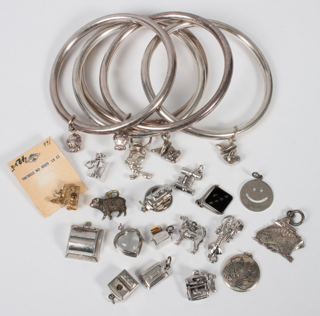 Appraisal: Group of sterling silver charms bangle bracelets comprising charms circa