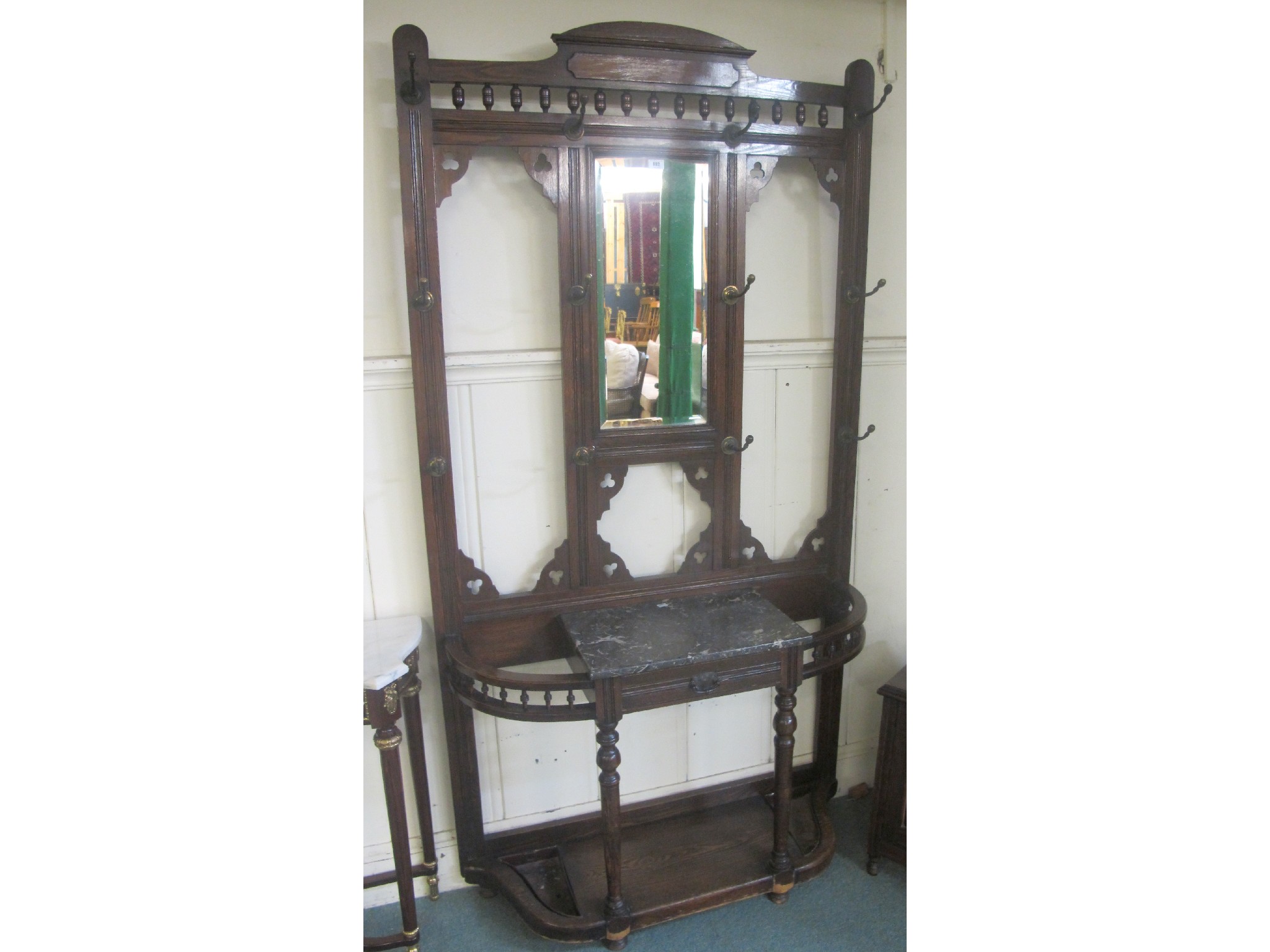 Appraisal: An Edwardian oak mirrored back hall stand