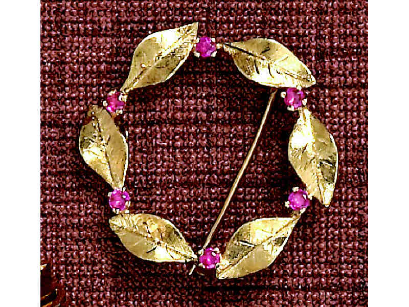 Appraisal: RUBY BROOCH k yellow gold circle design set with six