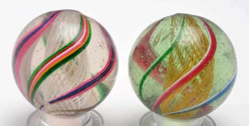 Appraisal: Lot of Latticino Swirl Marbles Description Includes one yellow and