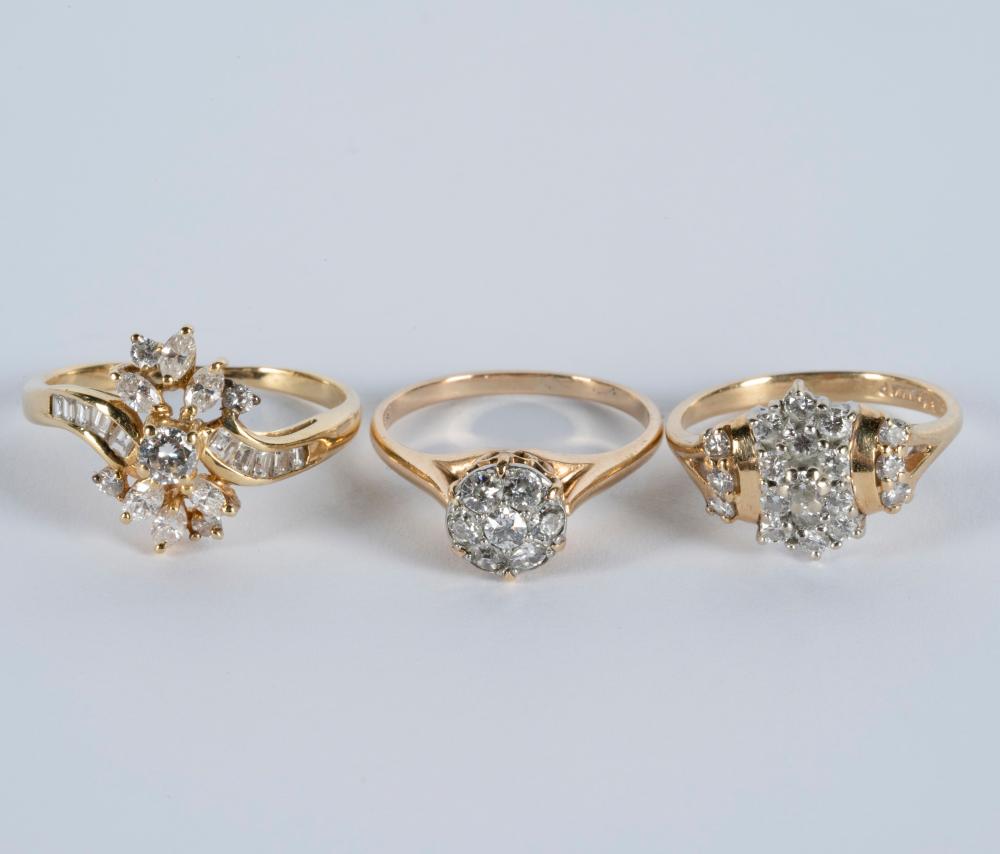 Appraisal: THREE ASSORTED YELLOW GOLD DIAMOND RINGS karat yellow gold cluster